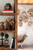 Wooden bookcase with rustic ornaments and dried flowers 