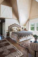 Country bedroom with vaulted ceiling 