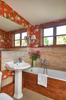 Patterned wallpaper in country bathroom 