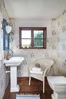 Wicker chair in small country bathroom 