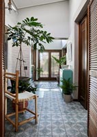Modern country hallway with patterned floor tiles 
