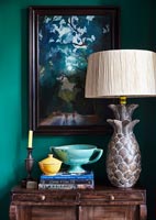 Large decorative lamp on wooden sideboard 