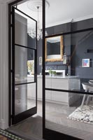 View through glass door to modern kitchen 