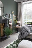 Classic living room with dark green walls 