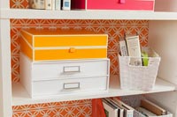 Filing boxes on bookcase shelves 