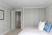 Modern bedroom with built-in wardrobes 
