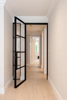 Black framed internal door to corridor 