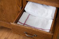 Dresser drawer with tea towels 