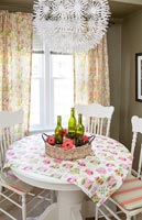 Country dining room with colourful tablecloth 