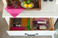 Open drawer in dresser with accessories 