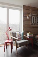 Modern living room with red angle poise lamp 