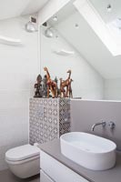 Decorative tiling in modern bathroom 
