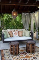 Wooden pergola with swing seat 