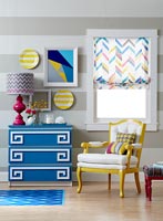 Colourful living room with geometric patterned accessories 
