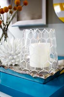 Detail of candle in patterned glass 
