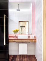 Modern bathroom with pink lighting 