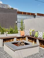Courtyard garden with built in seating and fire pit 