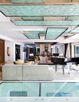 Contemporary living room with glass flooring 
