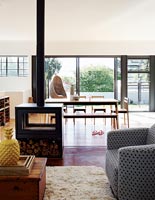 Modern open plan living space with log burning stove 