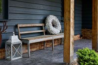 Rustic bench under veranda 