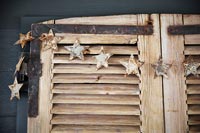 Wooden window shutters decorated with stars
