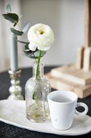 White crockery and vase with flower 