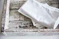 White napkins in wooden drawer