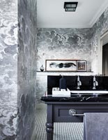 Grey storm cloud patterned wallpaper in classic bathroom 