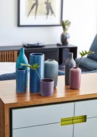 Modern vases displayed on sideboard