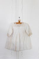 White vintage dress on hanger 