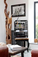 Bird cage on side table 