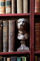 Dog bust on bookshelf 