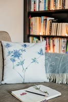 Bookcase and floral cushion