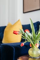 Yellow cushion and flowers 