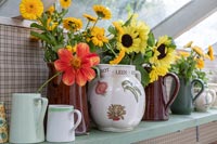 Country vases of autumn cut flowers