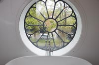 Old round church window in the bathroom 