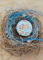 Ornamental egg in nest 