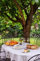 Fruits and cake on garden table
