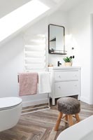 Small fluffy stool in modern bathroom 