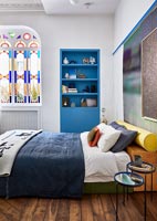 Stained glass windows in modern bedroom 