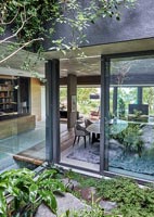 View into contemporary home through sliding patio doors 