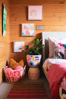 Colourful childrens room with decorative pot for houseplant 