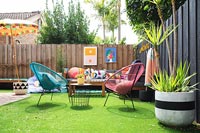 Colourful outdoor living area with artificial grass 