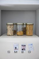 Jars of pasta and noodles on retro fridge freezer 