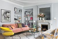 Grey painted walls in modern living room with period details 