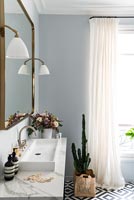 Classic marble sink unit with brass mirror 