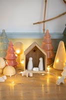 Modern nativity set with fairy lights 