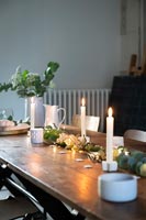Candles and Christmas decorations on Christmas table 