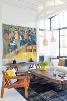 Large artwork on wall of contemporary living room 