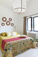 Colourful bedding in modern bedroom 